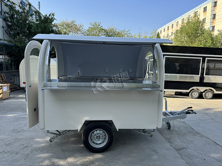 White Mobile Food Cart equipped with AL KO type chassis