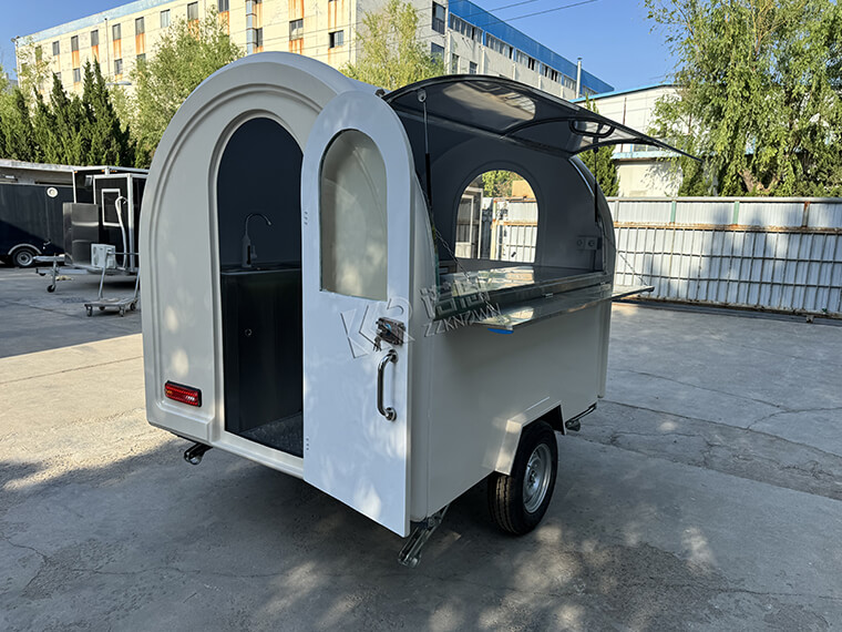 White Mobile Food Cart equipped with AL KO type chassis